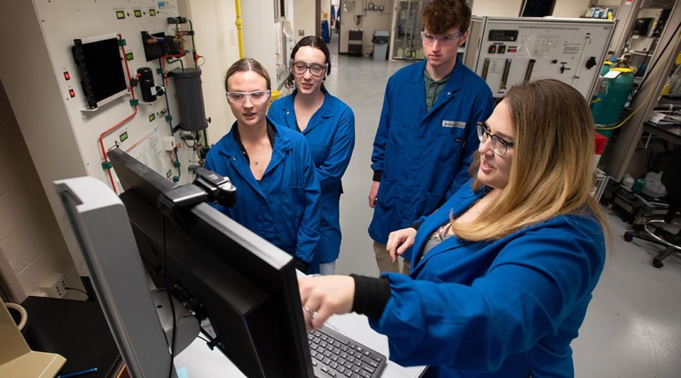 Goodrich with students in CBE lab