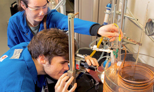 Two undergraduate students using equipment in the Schleckser Family Unit Operations Laboratory