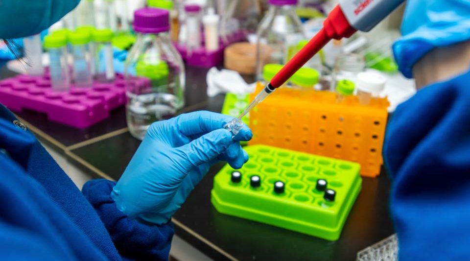 Researcher in Webber Lab setting up a sample